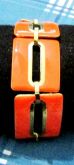Pulseira de metal laranja